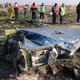Rescue teams comb over the scene of a Ukrainian airliner that crashed shortly after takeoff near Imam Khomeini airport in the Iranian capital Tehran.